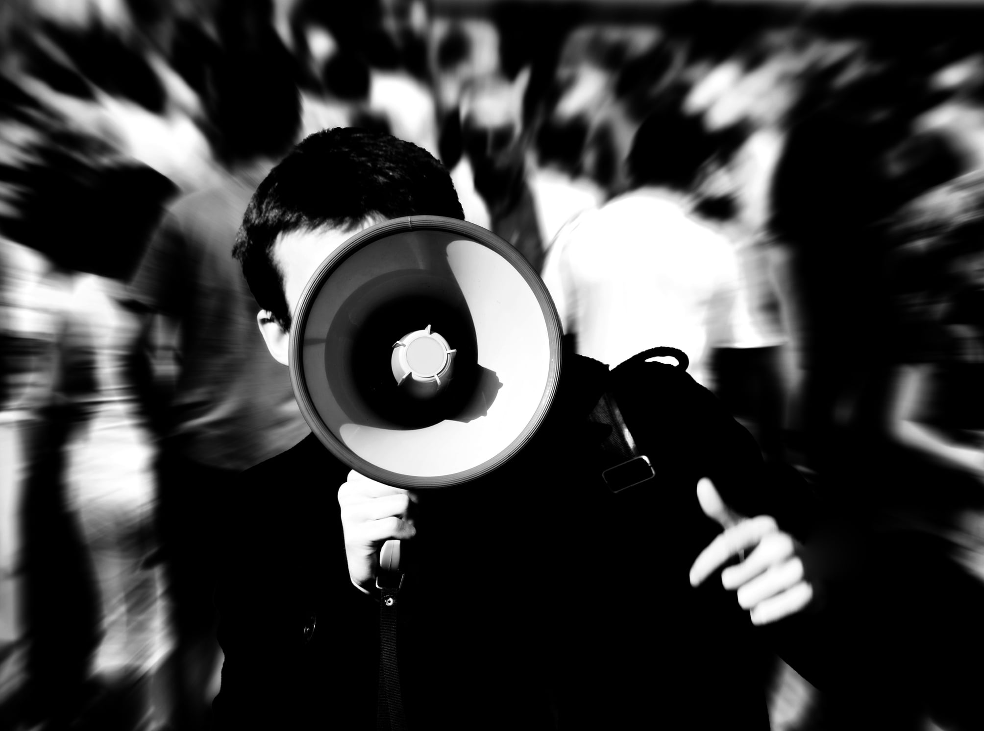 Vista and San Diego Unlawful Assembly Defense Lawyer 1 A man holding a megaphone to illustrate Unlawful Assembly in California; 407 & 408 (PC)