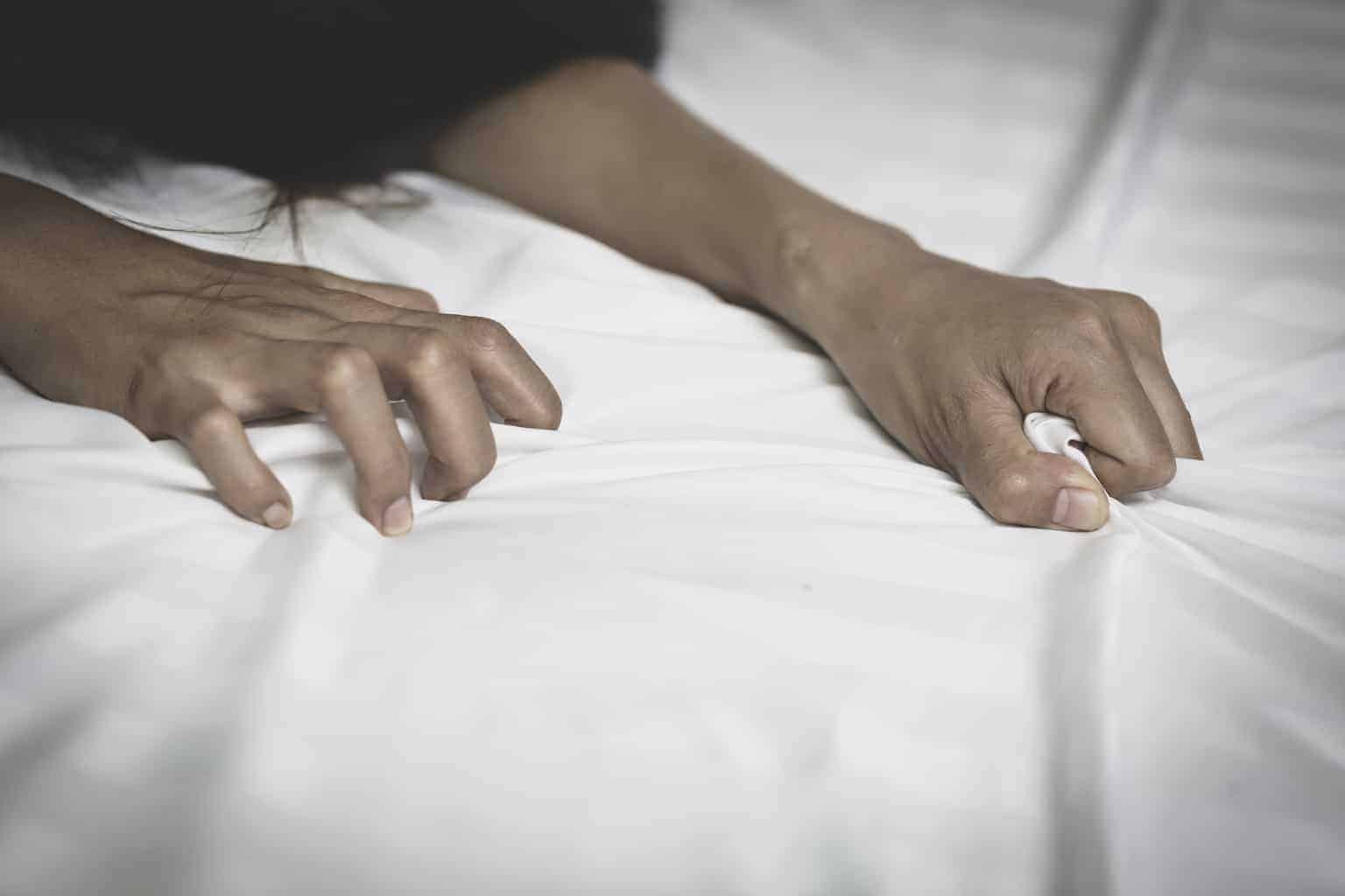 Non-Consensual Condom Removal, AKA "Stealthing," is Illegal in California 1 A woman's hands grabbing sheets on a bed