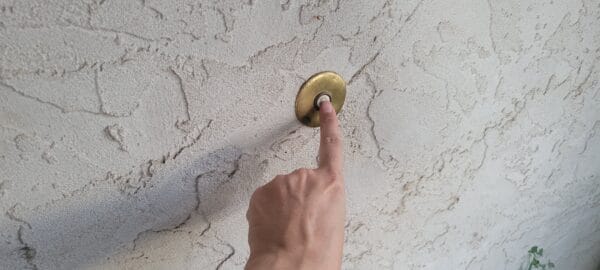 Is it a Crime to Doorbell/Ding Dong Ditch? 1 A person is pressing a doorbell to illustrate whether ding dong ditching is a crime