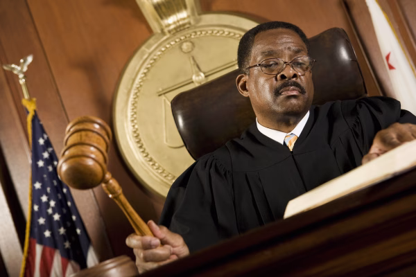 DUI Court Process 1 A judge holds his gavel, during the trial phase of the DUI process